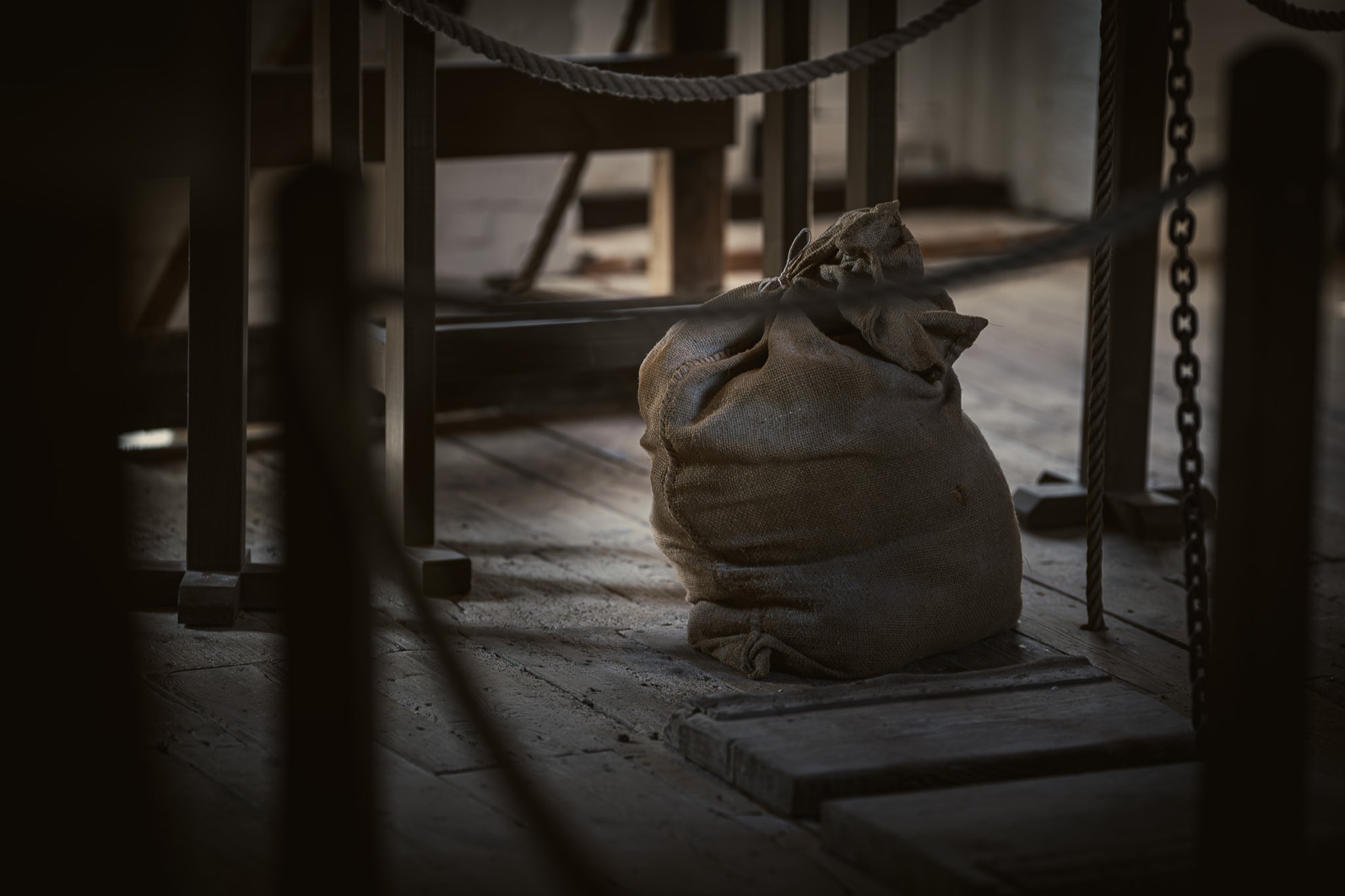 A vertical hoist way and timber structure inside Cogglesford Mill.