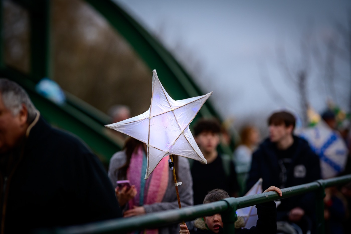 A bright white star lantern carried through a Sleaford crowd at the Riverlight festival.