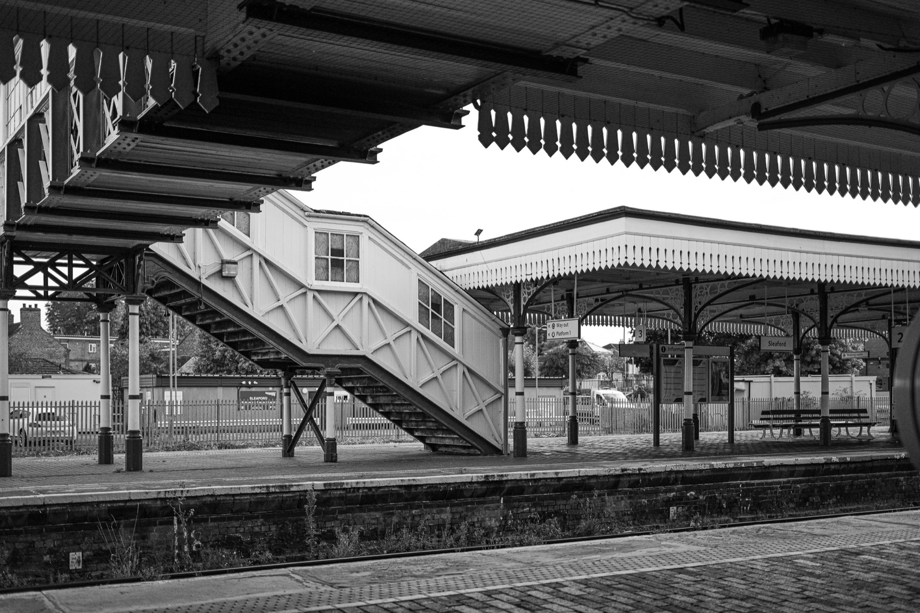Black and white railway station platform in Sleaford