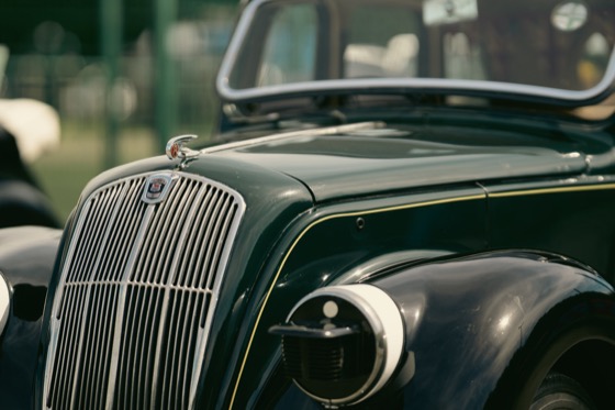 Close view of a Morris Eight grille and bonnet badge at a 1940s themed event.