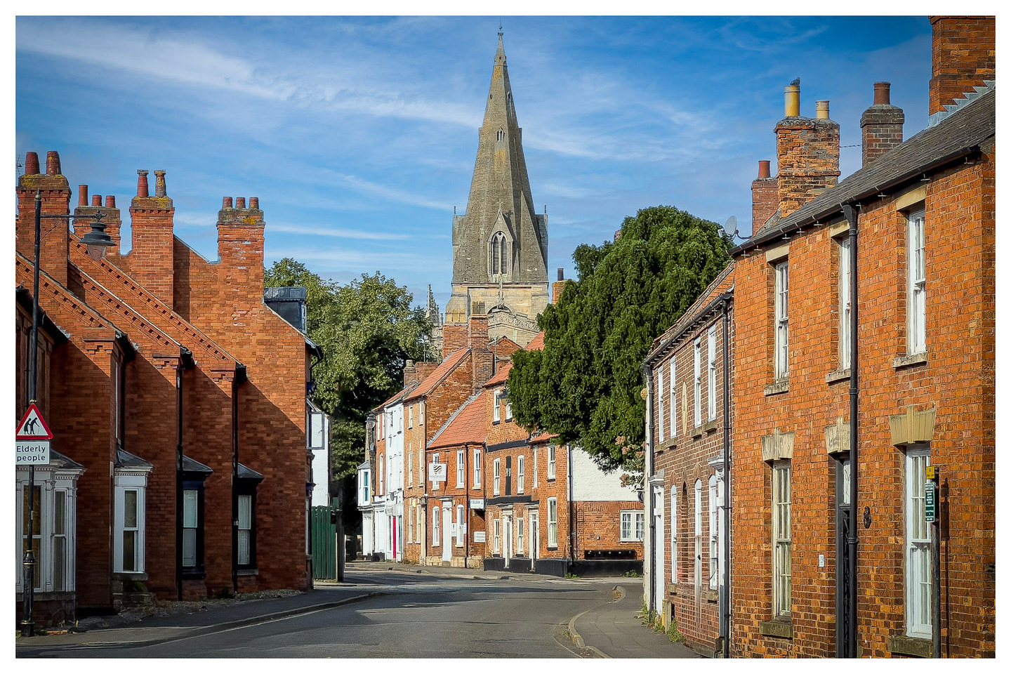 A pedestrian passing Ravenous on Eastgate, Sleaford, in August 2024