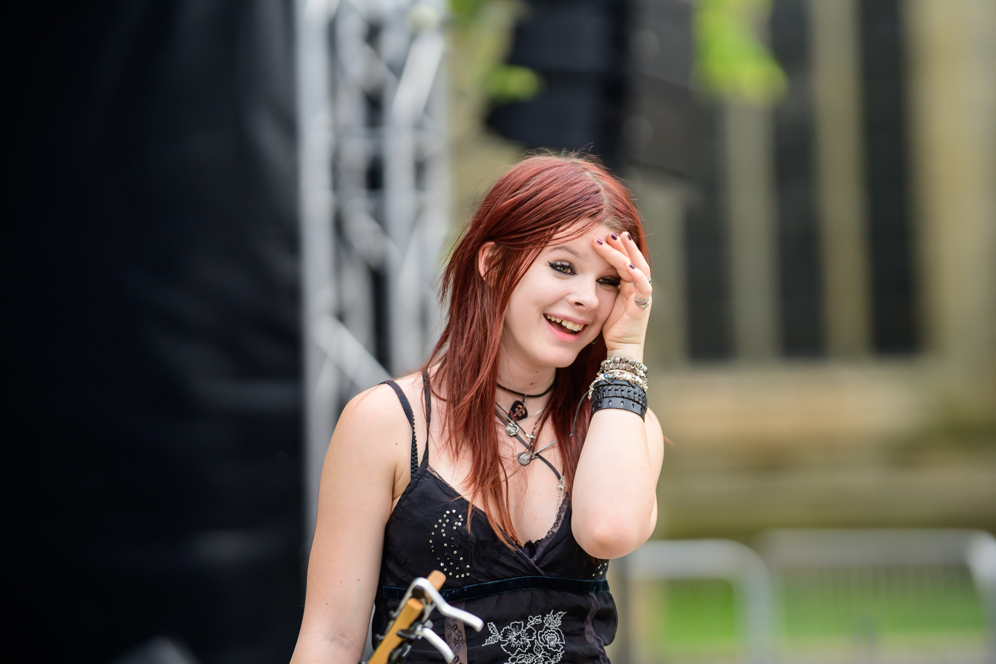 Young performer smiling near the stage