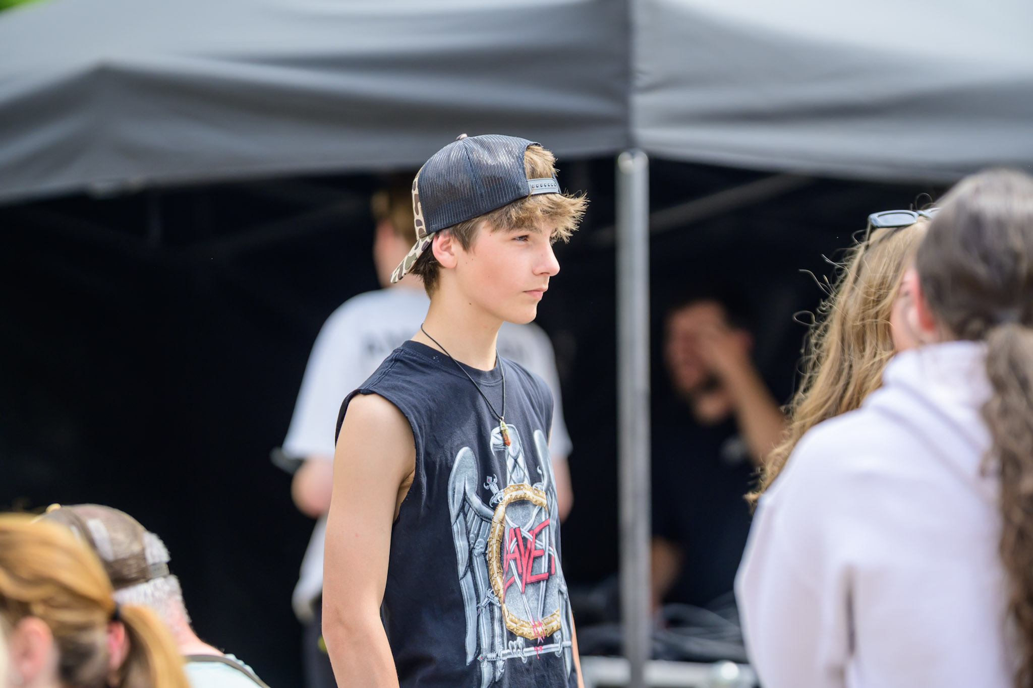 Young person standing near the festival stage