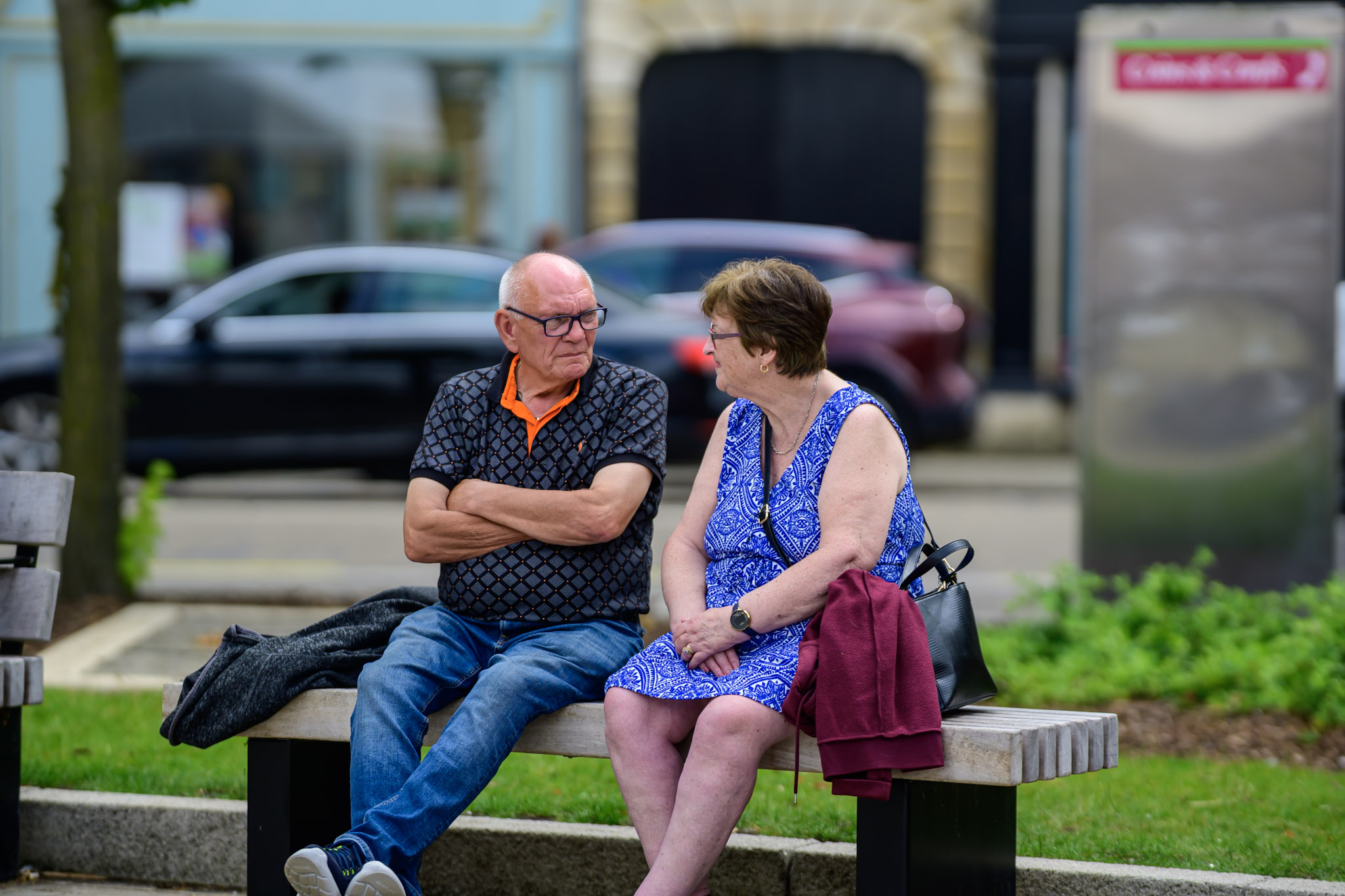 Two people talking on a bench in Sleaford during the festival