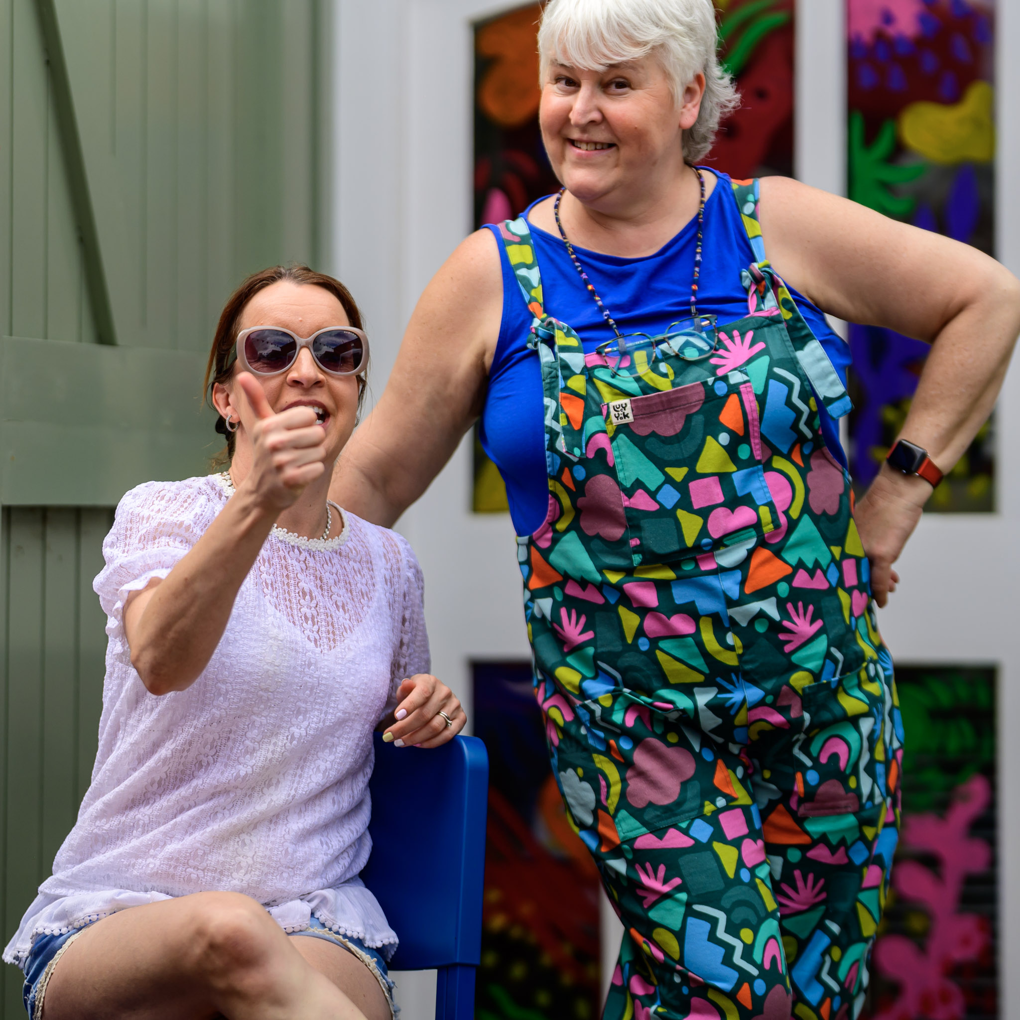 Two women at an art or activity space during the festival